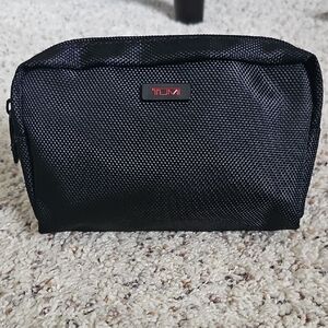 TUMI Black Toiletry Bag with items